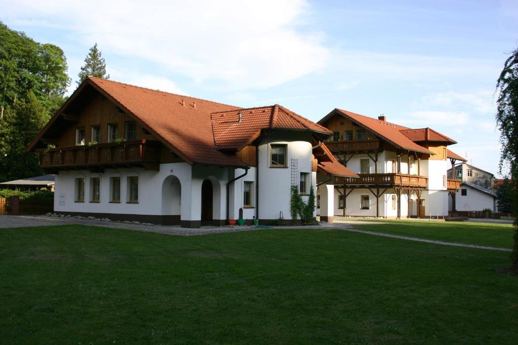 Pension 222 guesthouse building in Vrchlabí with wooden balconies and garden
